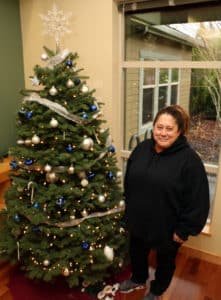 Kat by one of the Christmas trees at Shepherd's Door.